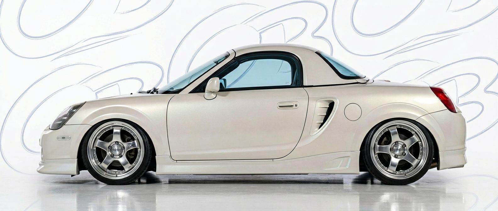 Professional automotive photography of a 2001 Toyota MR2 Spyder with high-fidelity 2001.