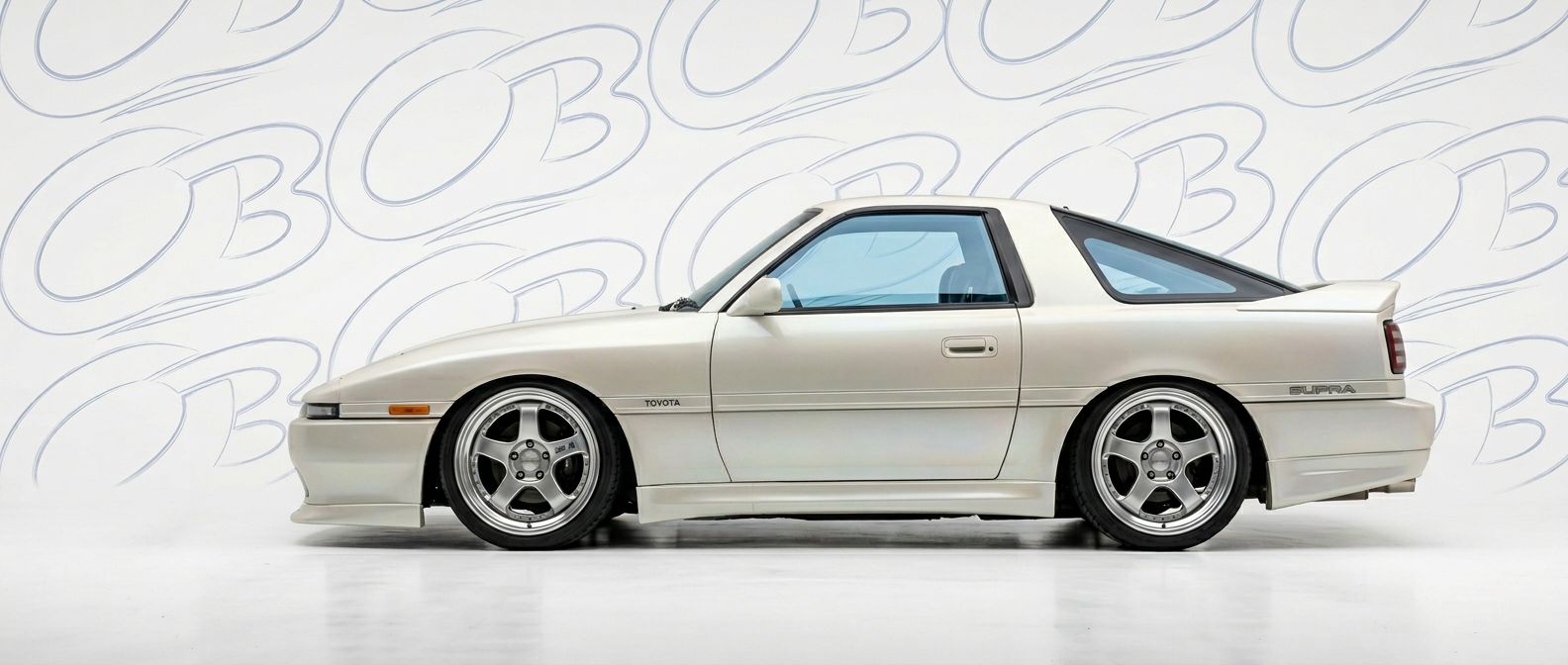 Professional automotive photography of a 1989 Toyota Supra with high-fidelity 1989.