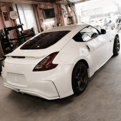 Nissan 370Z 2009-2020 Nismo V2 Style 1 Piece Polyurethane Rear Bumper image - 1