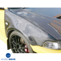 ModeloDrive Carbon Fiber EVO5 Wide Body Fenders (front) > Mitsubishi Evolution EVO5 EVO6 1998-2001> 4dr image - 2