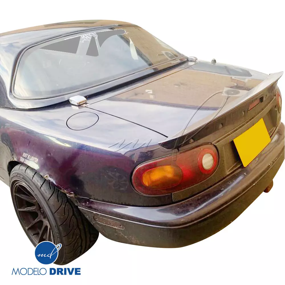 ModeloDrive Carbon Fiber OER US Tailgate Panel Garnish > Mazda Miata (NA) 1990-1996 - Image 1